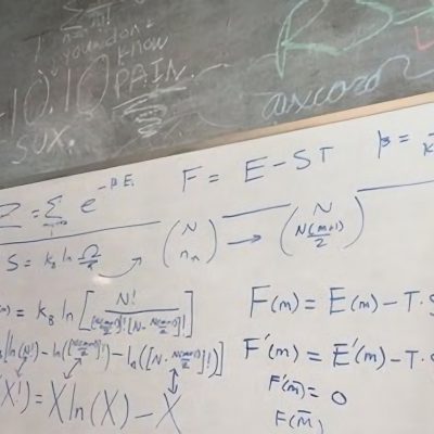 Whiteboard with equations on it